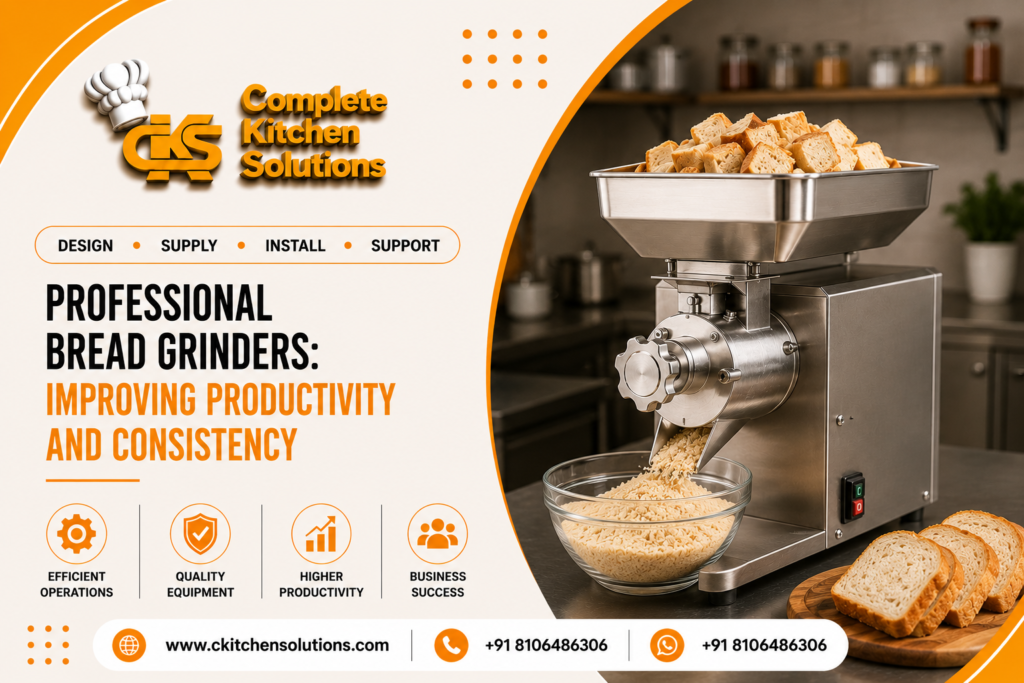A promotional banner for "Complete Kitchen Solutions" titled "Professional Bread Grinders: Improving Productivity and Consistency," featuring a heavy-duty stainless steel commercial bread grinding machine processing cubed bread pieces into crumbs on a countertop inside a kitchen.