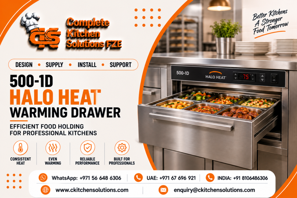 A promotional banner for "Complete Kitchen Solutions FZE" titled "500-1D Halo Heat Warming Drawer: Efficient Food Holding for Professional Kitchens," featuring a stainless steel built-in Halo Heat warming drawer pulled open to show hot food pans containing cooked vegetables, pasta, and meatballs in a commercial kitchen setup.
