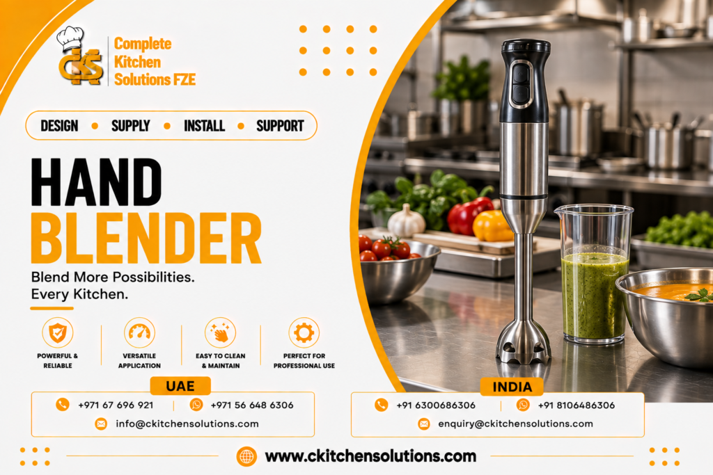 A promotional banner for "Complete Kitchen Solutions FZE" titled "Hand Blender: Blend More Possibilities. Every Kitchen," featuring a heavy-duty stainless steel commercial immersion hand blender standing upright beside a beaker of green puree, a bowl of blended soup, and fresh prep ingredients on a commercial kitchen stainless steel countertop.