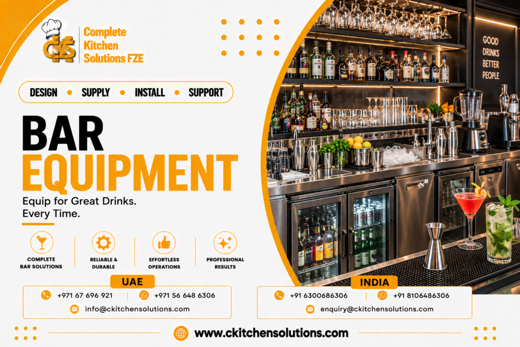 A promotional banner for "Complete Kitchen Solutions FZE" titled "Bar Equipment: Equip for Great Drinks. Every Time," showcasing an upscale commercial stainless steel bar counter setup complete with glass-door back bar bottle coolers, built-in ice wells, cocktail shakers, blenders, hanging stemware racks, and finished cocktails on a rubber bar service mat.