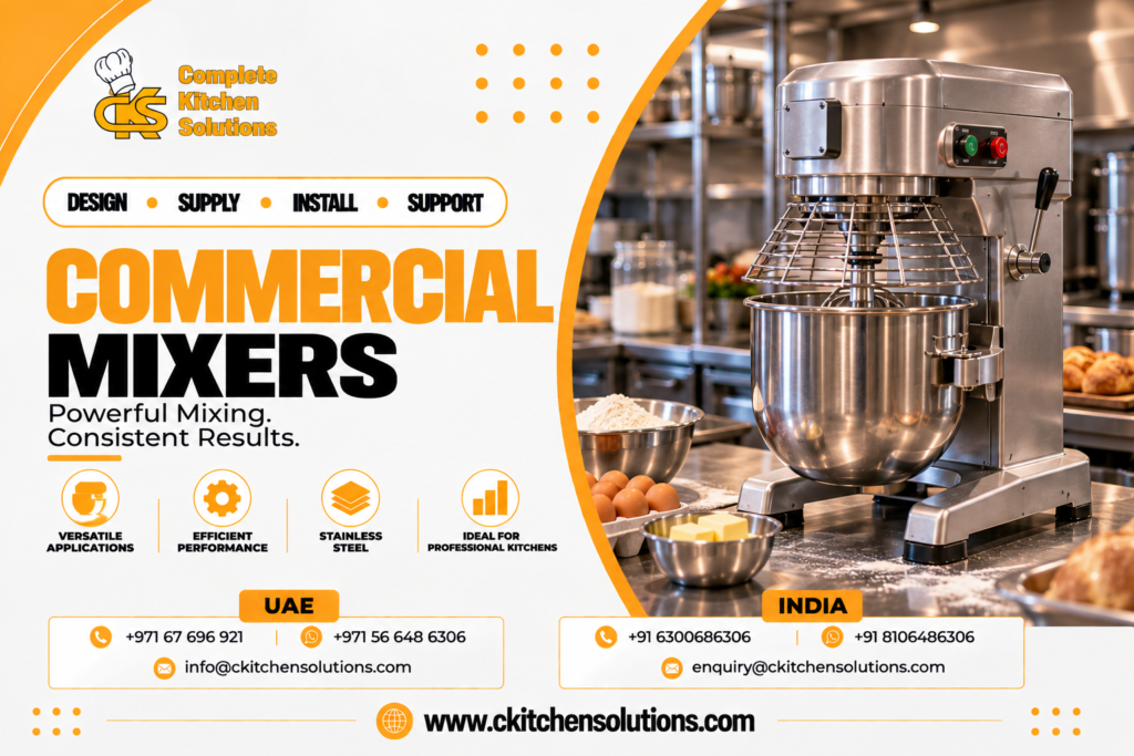 A promotional banner for "Complete Kitchen Solutions" titled "Commercial Mixers: Powerful Mixing. Consistent Results," showcasing a heavy-duty commercial stainless steel planetary stand mixer with a wire safety guard and mixing bowl, set on a bakery prep counter with flour, fresh eggs, butter, and baked bread in an industrial bakery kitchen.